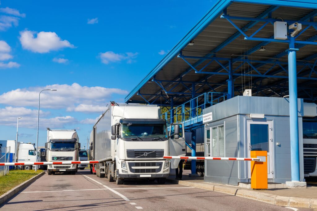 Trucks going through customs on their way to deliver e-commerce order