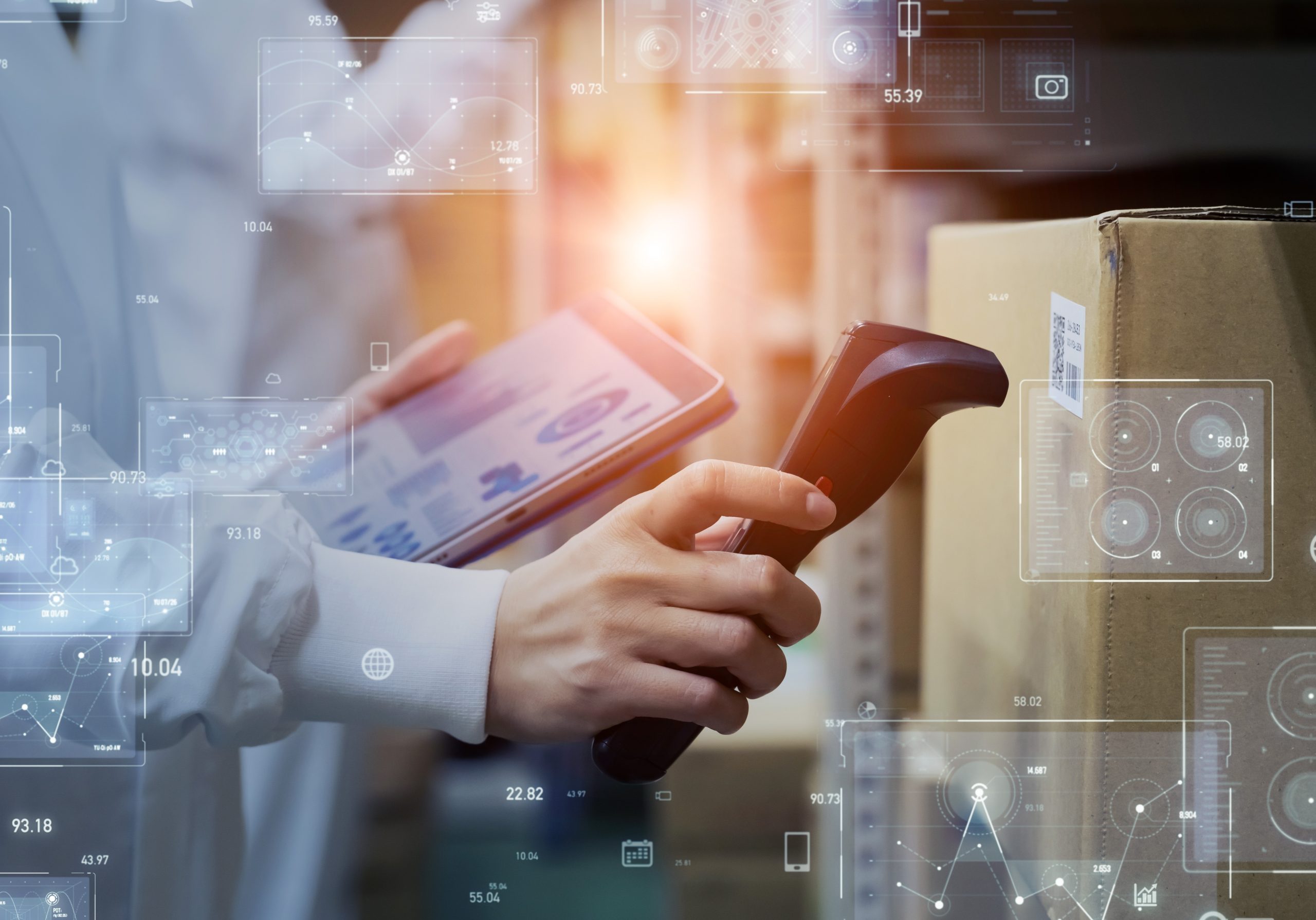 Man using electronic inventory management for third party logistics in a warehouse near the Canada-US border